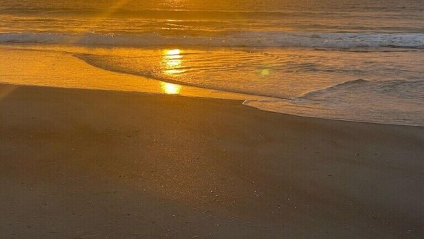 A beach with the sun setting over the ocean. - Summer Pool Retreat Near Vilano Beach (St. Augustine)