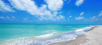 4BR Luxury Beachfront Retreat with Designer Finishes & Panoramic Gulf Views