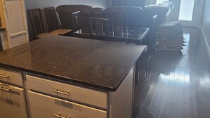 A kitchen with a central island, dark wooden flooring, and pendant lighting. - Pet friendly- 1/2 block from beach Seaside Heights/Seaside park - ocean views.  (Seaside Heights)