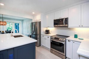 Microwave, coffee/tea maker, toaster, cookware/dishes/utensils