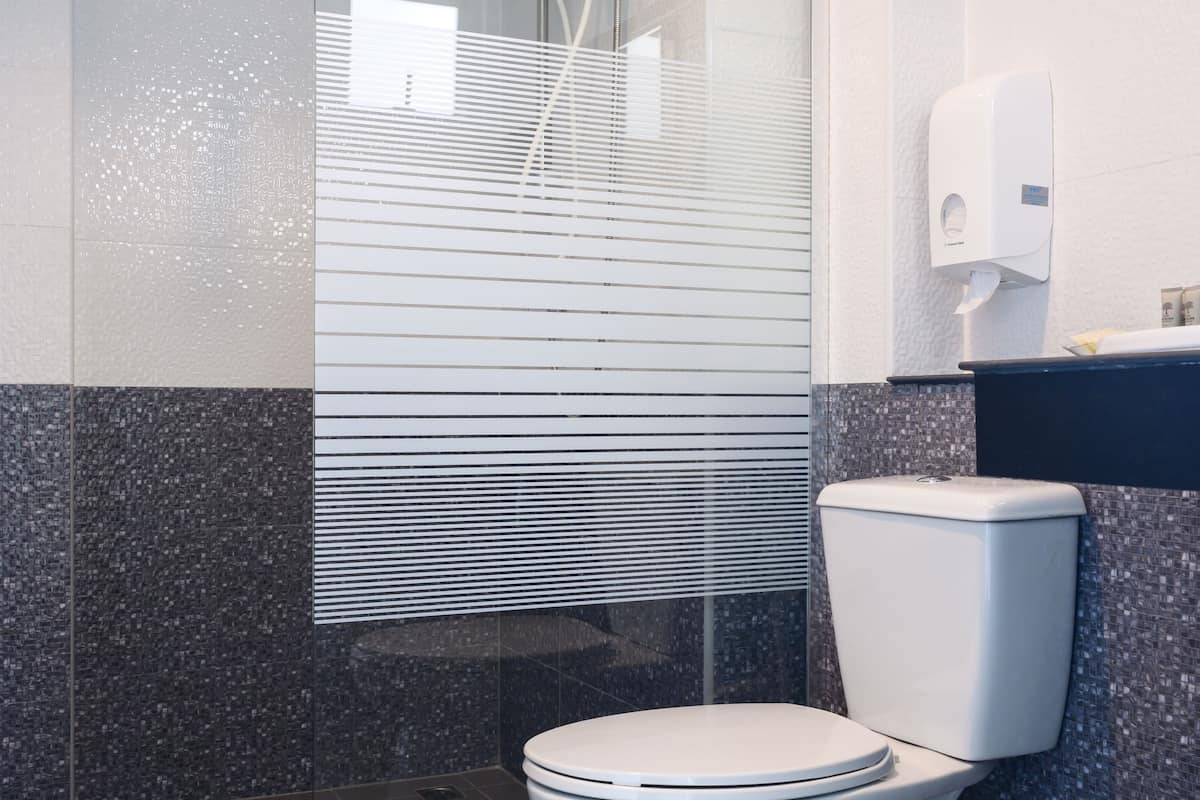 superior triple room | bathroom | shower, hair dryer, towels, soap