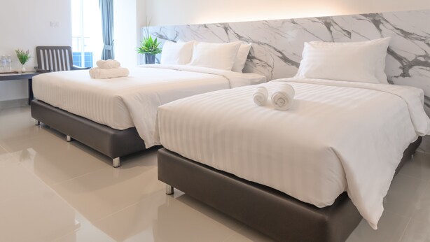 A modern hotel room with two beds, a marble headboard, and a view of the outdoors. - Donmueang Place Hotel (Bangkok)