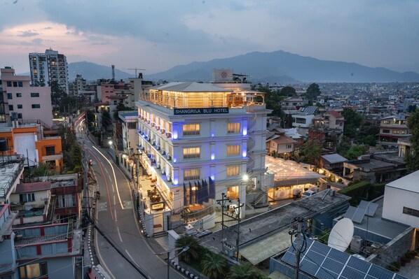 A multi-story hotel with balconies, a rooftop area, and solar panels. - Shangrila Blu Hotel (Lalitpur)