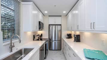 Microwave, coffee/tea maker, toaster, cookware/dishes/utensils