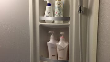 Shower, hair dryer, slippers, towels