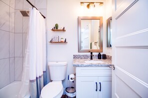 Bathtub, hair dryer, towels, soap