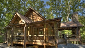 A wooden cabin with a porch, a chimney, and a deck. - Dog Friendly, PAVED 2 lane access, Aska Adventure Area, Minutes to Downtown (Blue Ridge)