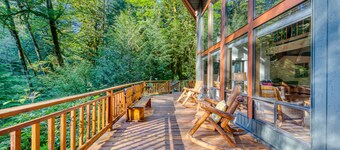 Creekside home with hot tub, deck, & great woodland views