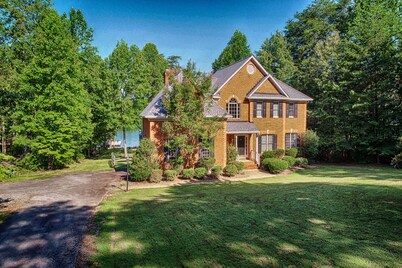 Lakefront home with boat dock, private firepit & game room - dog-friendly