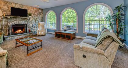 Lakefront home with boat dock, private firepit & game room - dog-friendly