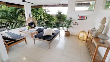 Family Villa, 4 Bedrooms | Living area | 43-inch Smart TV with cable channels