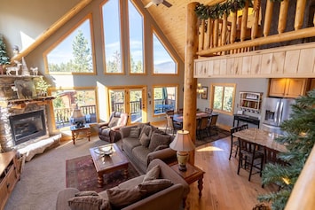 Relax by the fire in the spacious yet cozy living room.