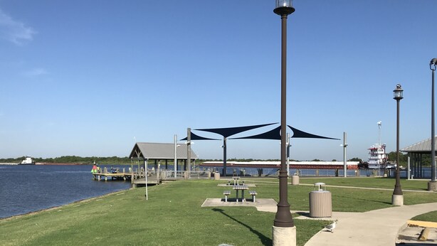 A waterfront park with a gazebo, picnic tables, and a walking path. - Cozy Cottage near the lake (Big Lake, LA) (Lake Charles)