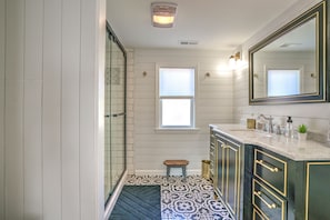 Combined shower/tub, hair dryer, towels, soap