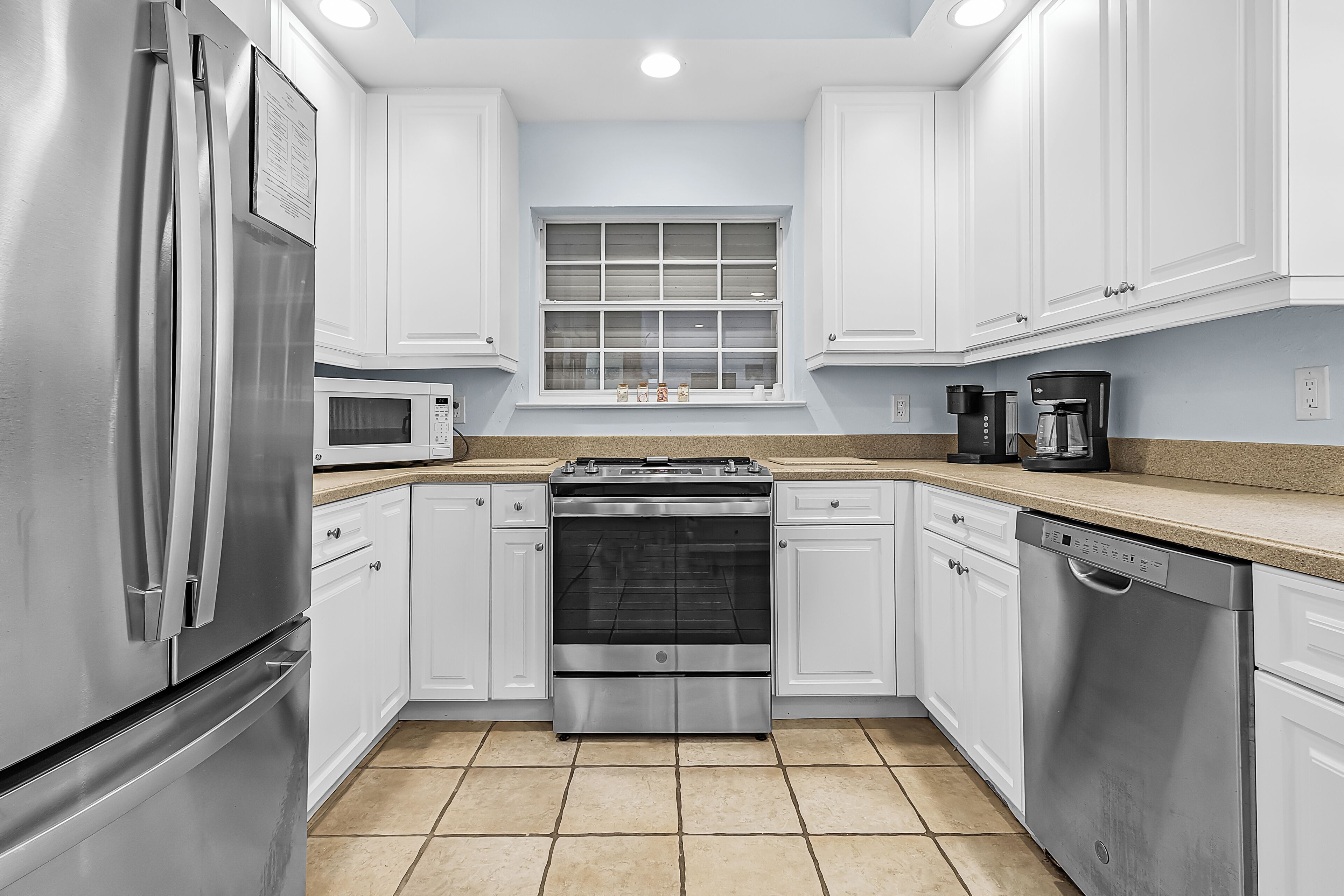 Microwave, coffee/tea maker, toaster, cookware/dishes/utensils