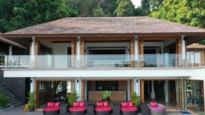 A two-story house with a pool, outdoor seating, and a balcony. - Victoria Cliff Nyaung Oo Phee Island (Kawthaung)