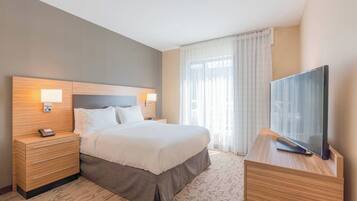 Suite, 1 Bedroom | Desk, laptop workspace, blackout drapes, iron/ironing board