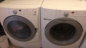 Two front-loading washing machines side by side in a laundry room. - Beautiful private 2 bedrooms/1 bathroom near campus (Boulder)
