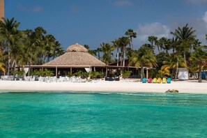 On the beach, sun loungers, beach towels
