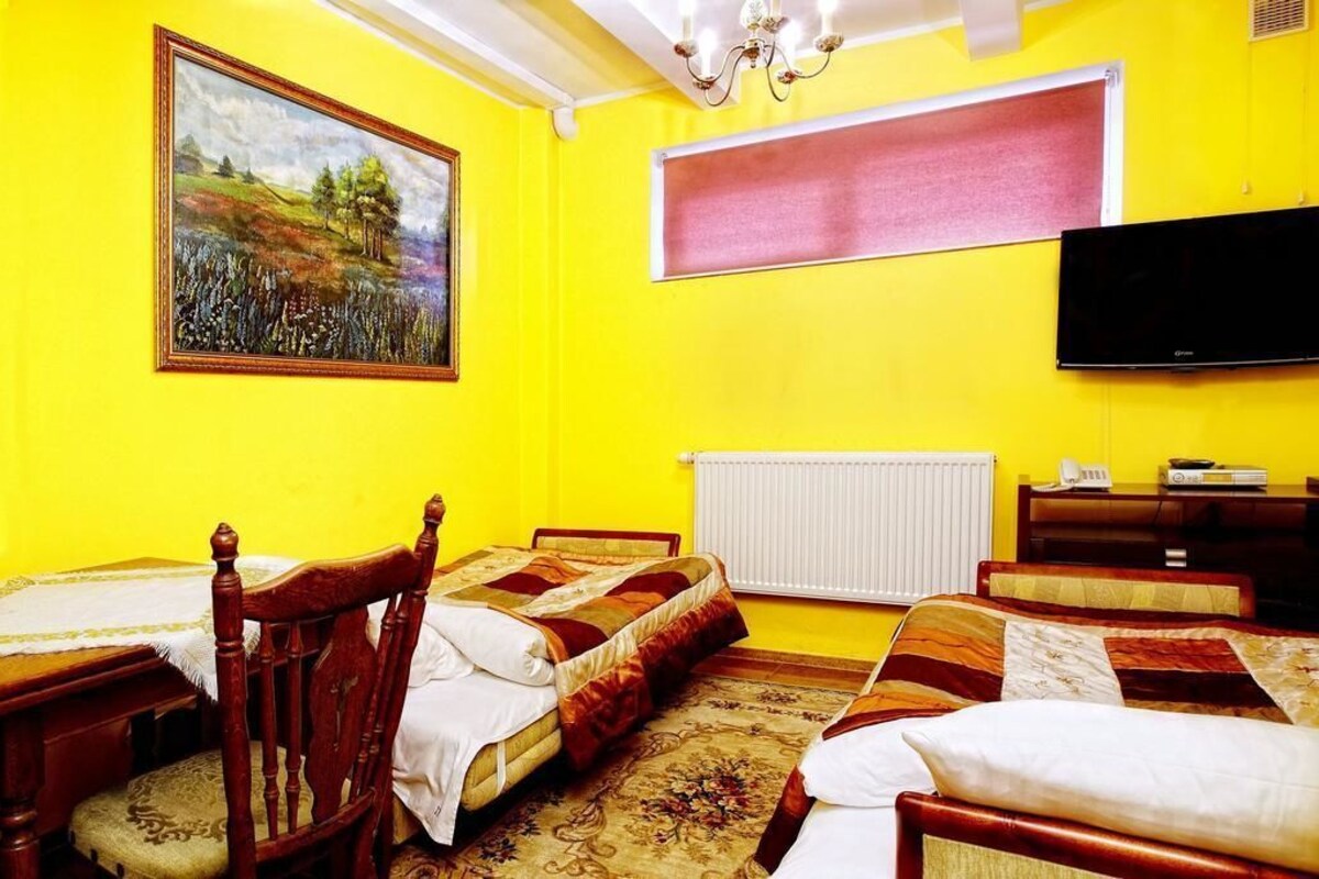 Premium bedding, laptop workspace, blackout curtains, soundproofing