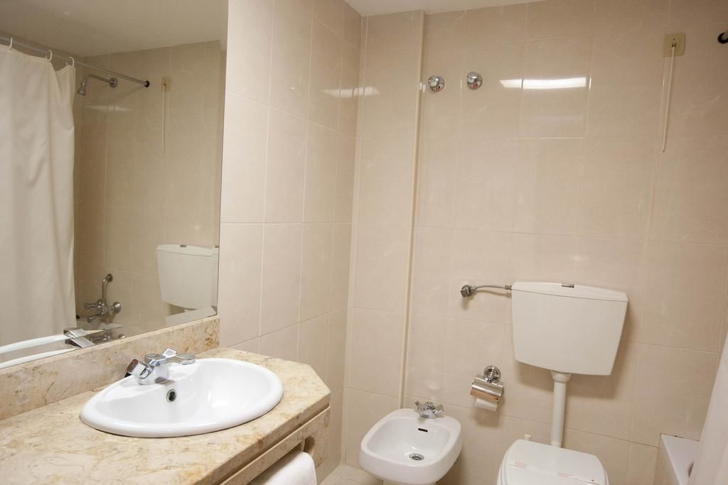 bathtub, hair dryer, bidet, towels