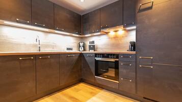 Exclusive Apartment | Private kitchen | Full-sized fridge, microwave, oven, stovetop