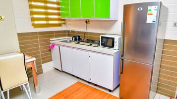 Apartment | Private kitchen | Fridge, microwave, cookware/dishes/utensils, cleaning supplies