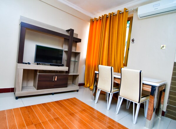 Apartment | Living area | 32-inch flat-screen TV with cable channels, TV - Regency Apartment (Dar es Salaam)