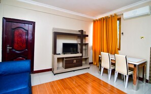 Apartment | Living area | 32-inch flat-screen TV with cable channels, TV - Regency Apartment (Dar es Salaam)