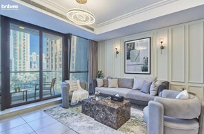 Elite Apartment | Living room | 42-inch TV with satellite channels, Netflix, streaming services - bnbme | Gold Crest Views | 2 BDR (Dubai)