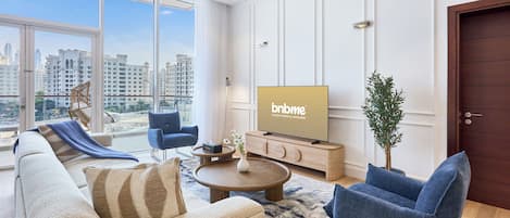 Deluxe Apartment | Living area | 42-inch LED TV with cable channels, TV, Netflix