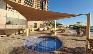 Outdoor pool, pool umbrellas, sun loungers