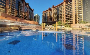 Outdoor pool, pool umbrellas, sun loungers