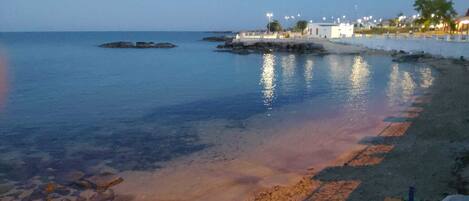 On the beach, sun-loungers, beach towels