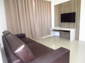 Apartamento | Área de estar | TV