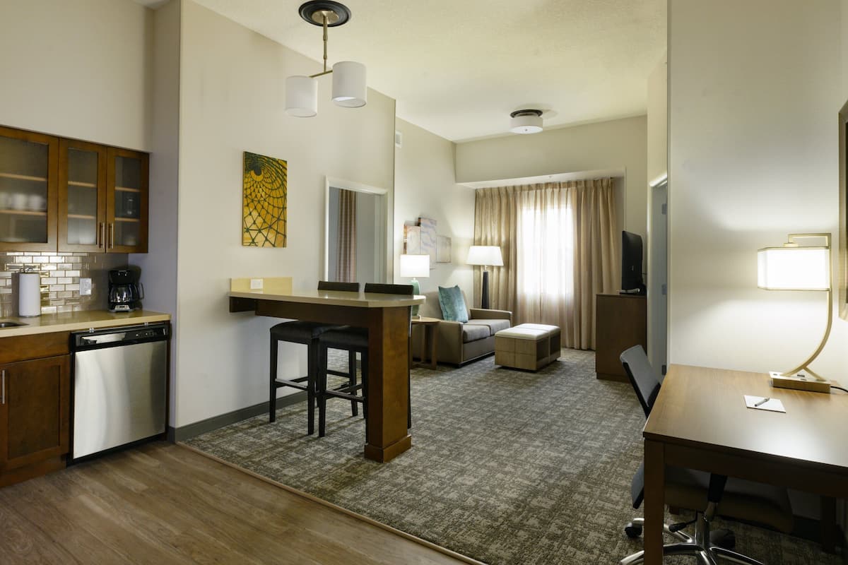 suite, 2 bedrooms, kitchen | 1 bedroom, individually furnished, desk, laptop workspace