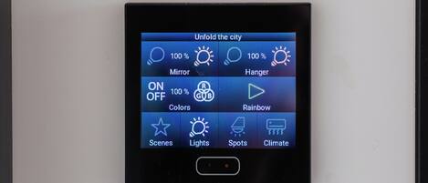 A control panel with options for 'Mirror', 'Hanger', 'Colors', 'Rainbow', 'Scenes', 'Lights', 'Spots', and 'Climate'.