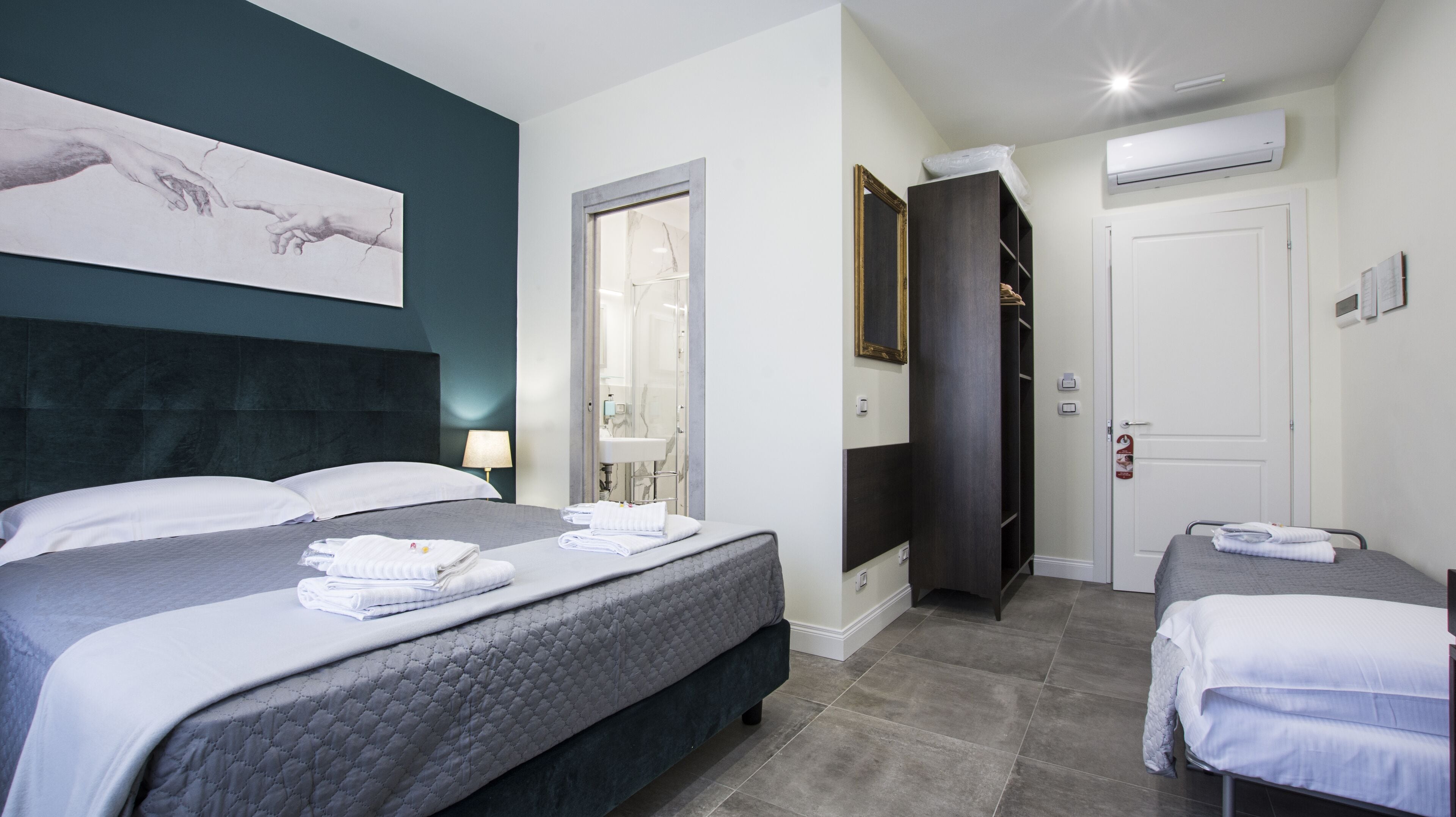 Economy Triple Room | Minibar, in-room safe, desk, laptop workspace