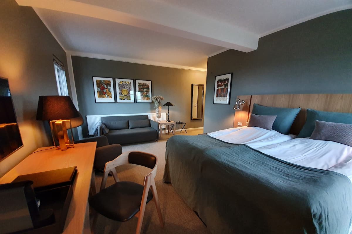 Suite, terrasse | 1 chambre, bureau, chambres insonorisées, lits pliants/supplémentaires