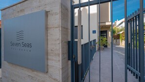 A gated entrance to a property named 'Seven Seas Residence' with a clear pathway leading to the entrance. - Seven Seas Residence (Split)