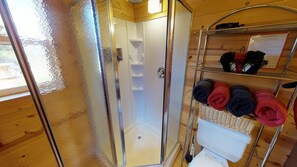 Cabin (White Pine Cozy Secluded Cabin, Stunn) | Bathroom | Shower, hair dryer, towels