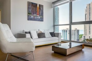 Deluxe Apartment, 3 Bedrooms | Living area | 55-inch Smart TV with cable channels, TV - Breath-taking Ocean View (Panama City)