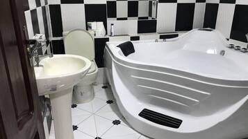 Comfort Apartment | Bathroom | Bathtub, spring water tub, towels