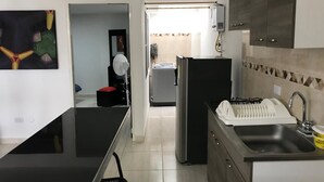 Apartment (Fan) | Private kitchen | Coffee/tea maker, fridge, microwave, oven - Apartamentos Nuevos (Cali)