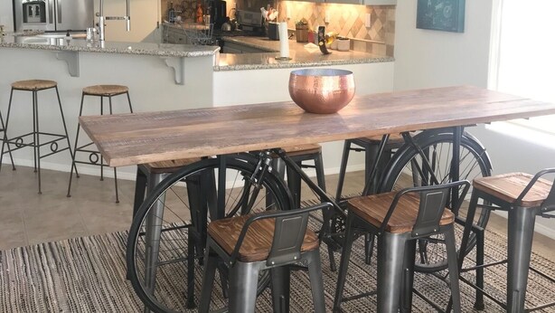 A modern kitchen with a large island, stainless steel appliances, and a chandelier. - Perfect Escape - Festival close, on golf course, private salt water pool, +++! (Indio)