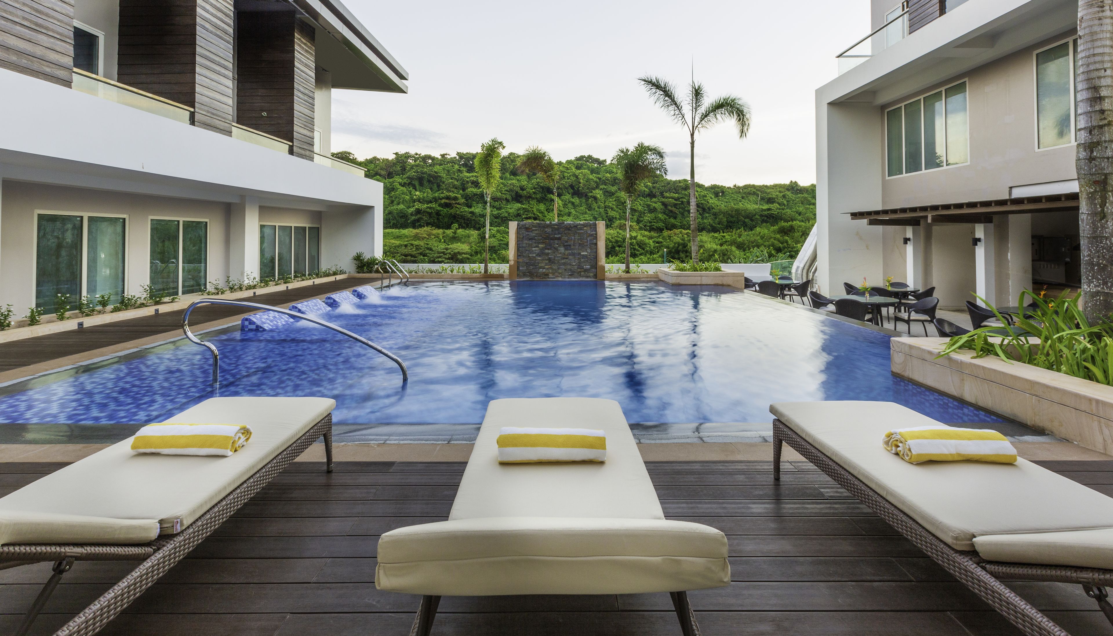 outdoor pool, open 7:00 am to 10:00 pm, pool umbrellas, pool loungers