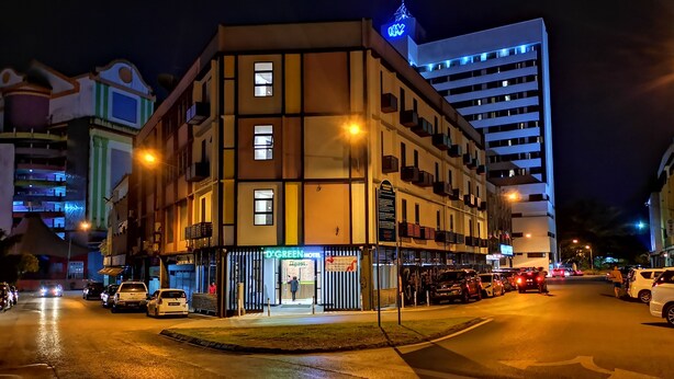 A multi-story hotel with a prominent sign for 'D-Green Hotel' and a visible entrance. - D'Green Hotel Kuching (Kuching)