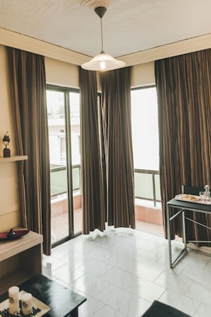 Standard Apartment, Multiple Beds, Balcony | Living area | 32-inch LCD TV with digital channels, TV