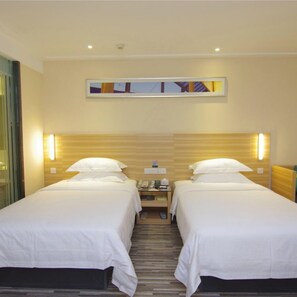 Habitación Deluxe con 2 camas individuales | Wifi gratis y ropa de cama 