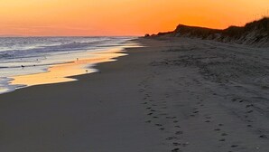 A beach with a clear sky and a sunset. - SeaToo Waterfront Condo (Hatteras)
